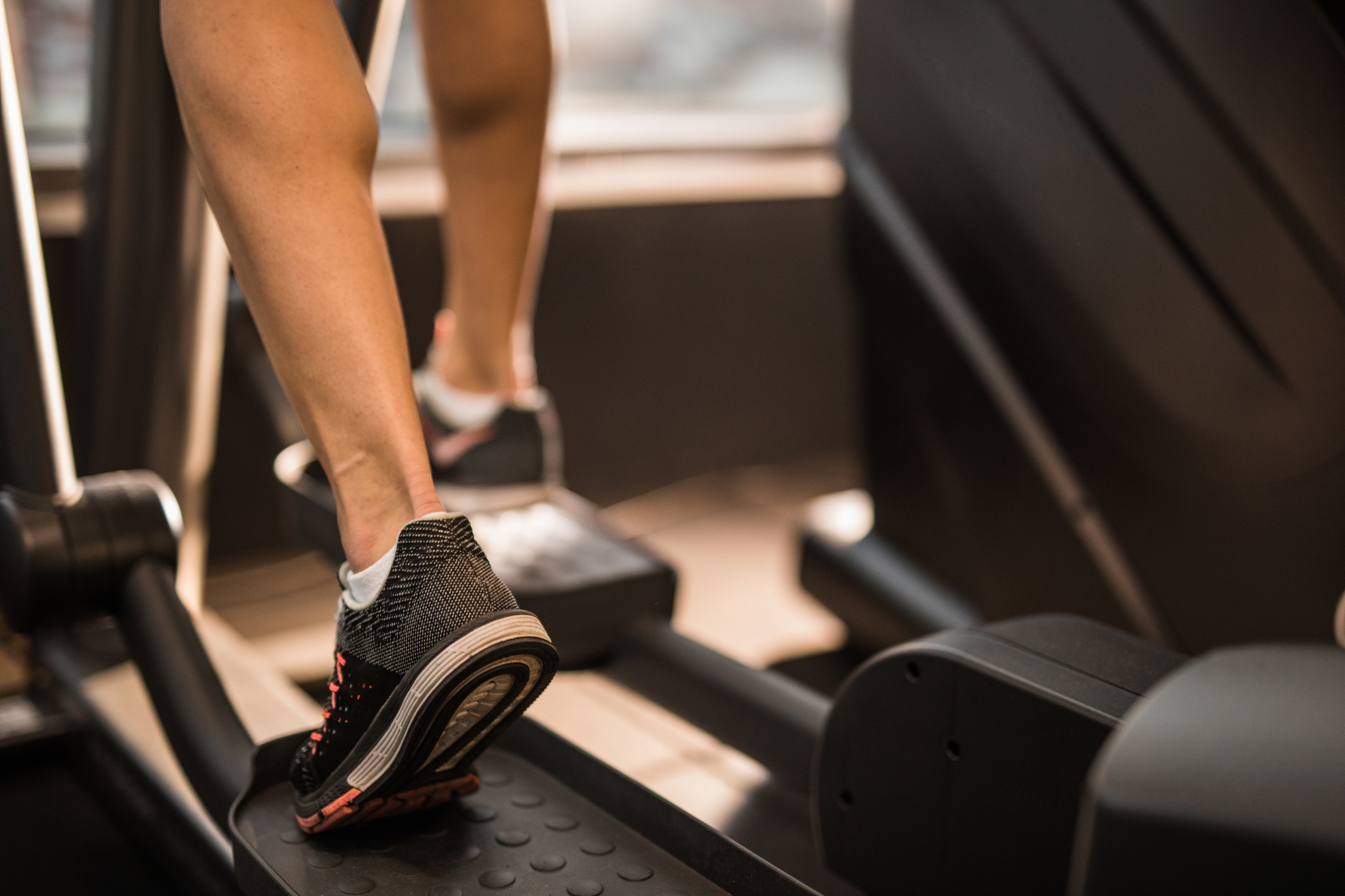 close up of unrecognizable athlete warming up on cross trainer in a myrtle beach gym